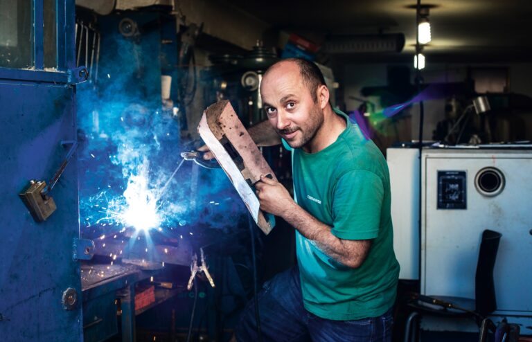 welder wearing a green colored, lightweight welding shirt