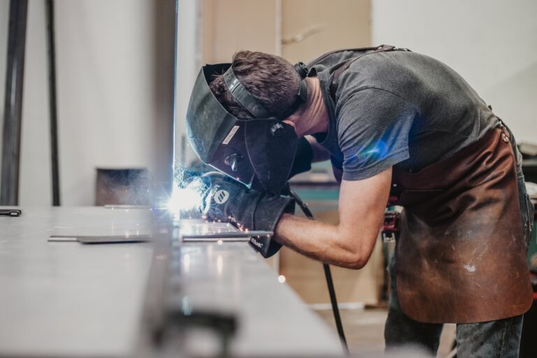 Welding Shirts in action. Welder welding wearing a welder shirt.