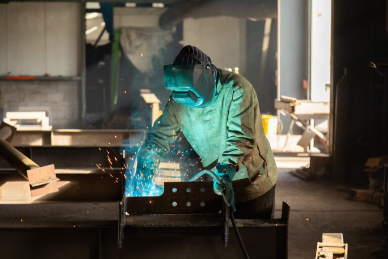 welder wearing a button up welding shirt